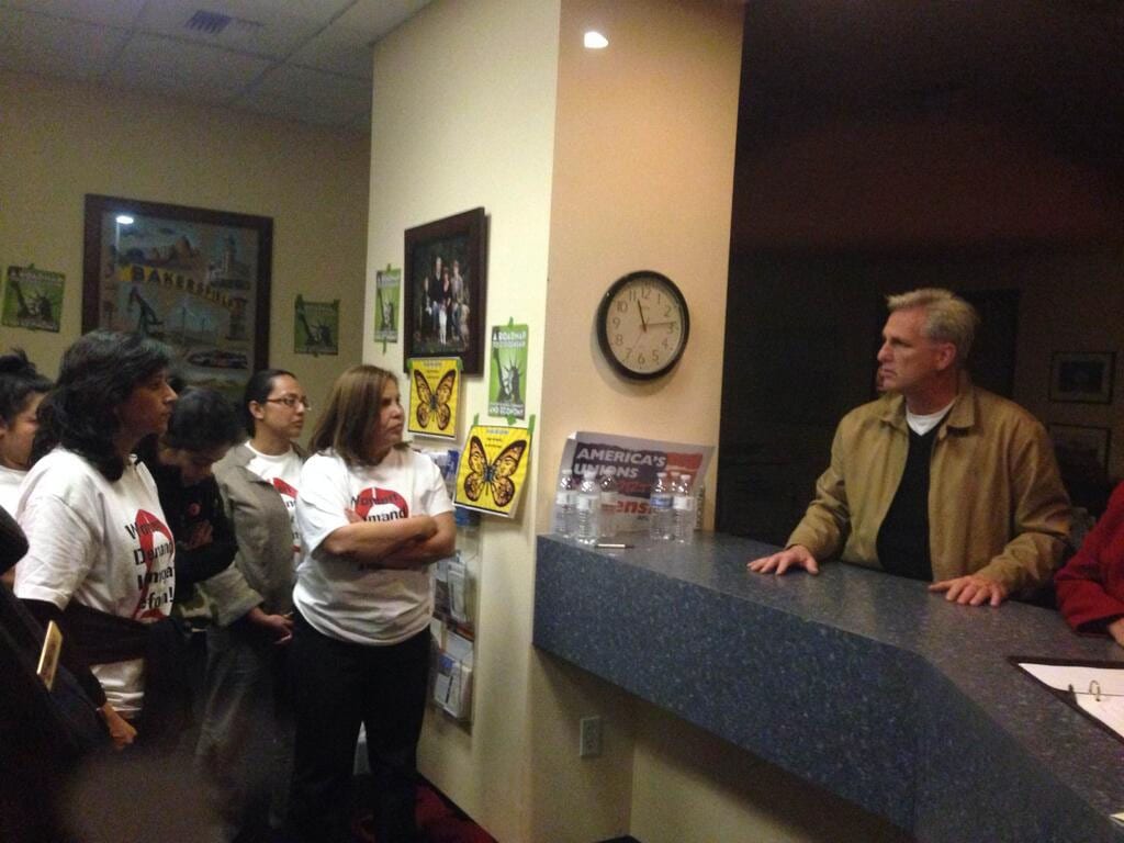 CHIRLA members, including Executive Director Angelica Salas, talk with Rep. McCarthy.