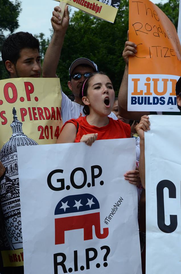 People held signs saying "G.O.P. R.I.P.?", suggesting that if they fail to act on immigration reform, Latino voting power will make their party obsolete.