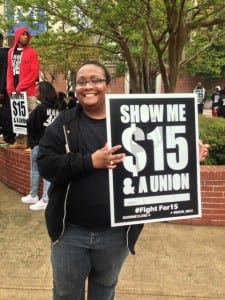 Letrice Donaldson, an adjunct instructor at the University of Memphis, earns only $1,500 per class that she teaches. Letrice, 34, estimates that she spends 20 hours a week preparing for her class, teaching and grading papers—which would make her hourly pay about $5.36 an hour. Letrice took part in the Fight for $15 rally in Memphis Wednesday. Photo credit: Wendi C. Thomas